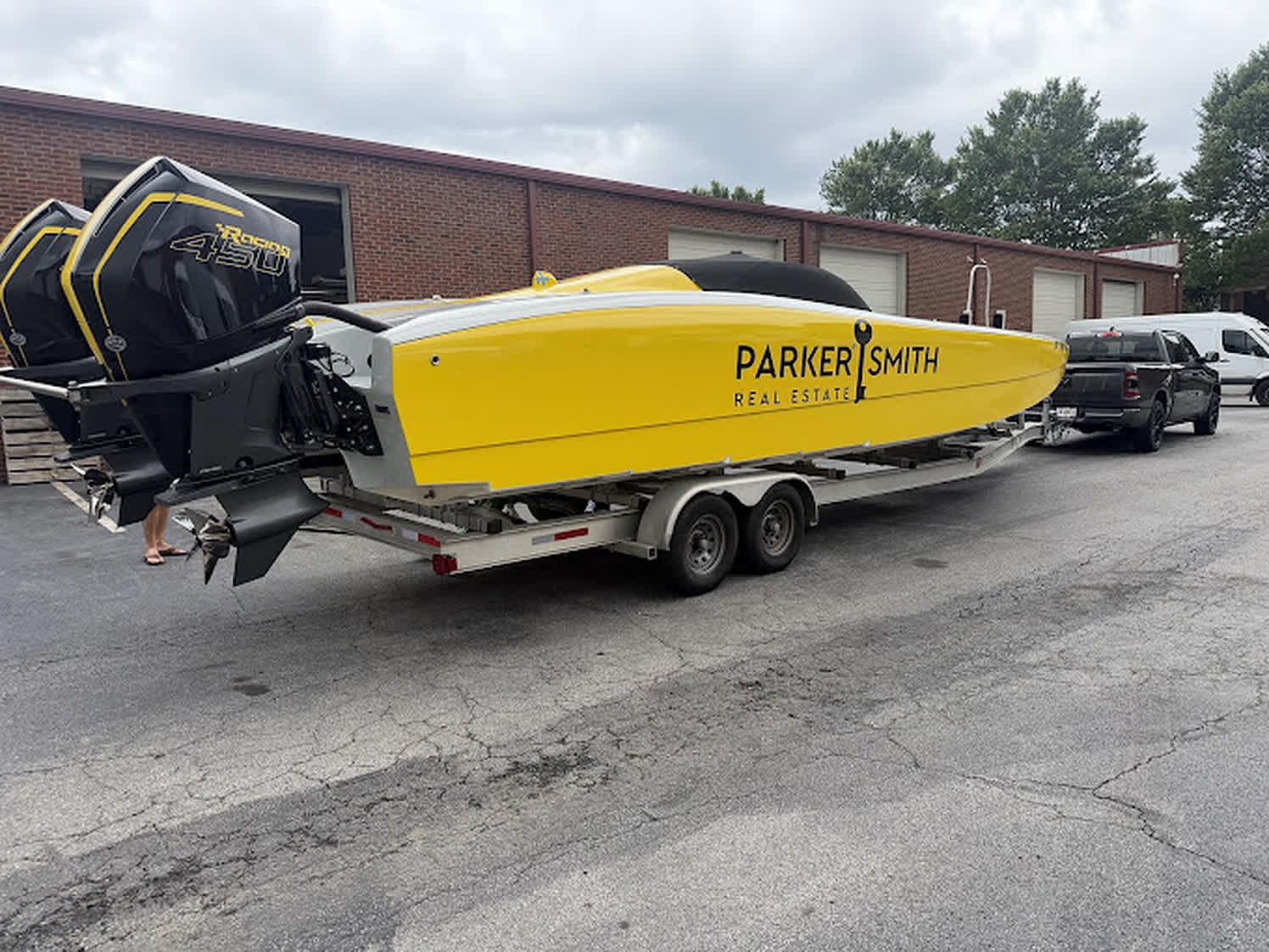 A customer's boat on a dual-axle trailer serviced at Unlimited Tire & Service