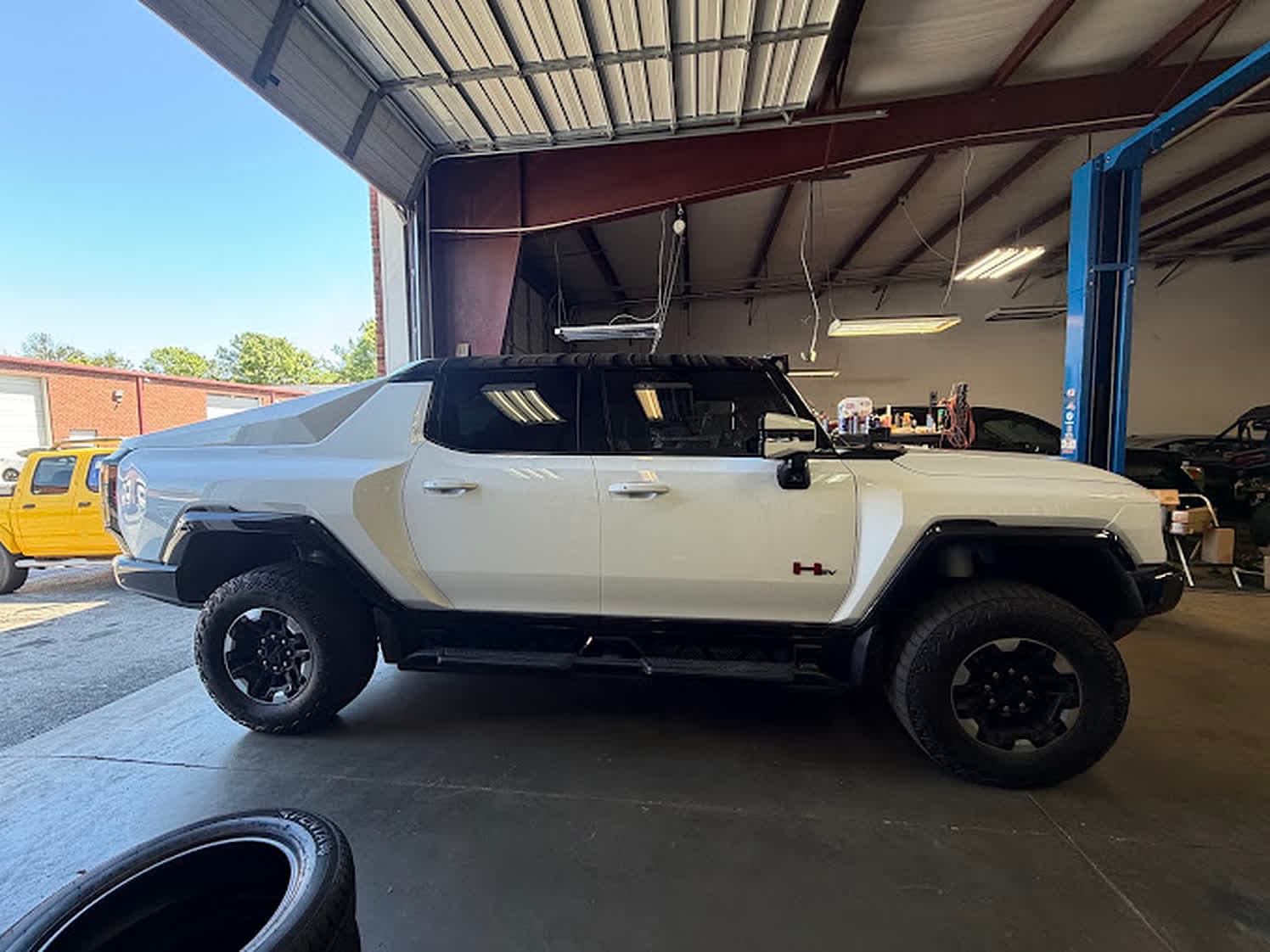 GMC Hummer EV in the service bay at Unlimited Tire & Service